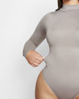 Sara Seamless Long-Sleeve Mock Neck Bodysuit – White Stretch Fit