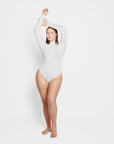 Sara Seamless Long-Sleeve Mock Neck Bodysuit – White Stretch Fit